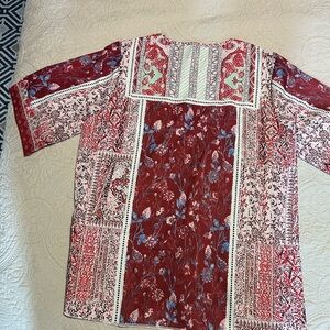 No name shirt. 
Silky polyester.